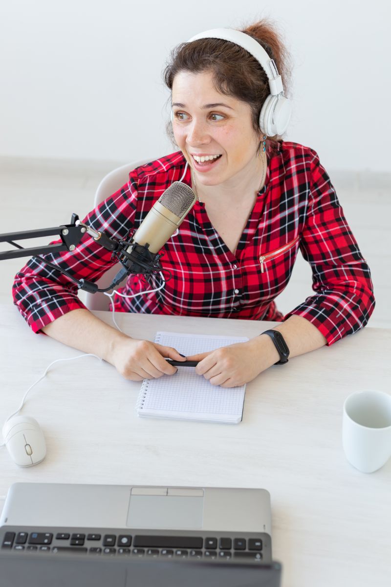 Radio, blogging, podcasting concept - close-up woman presenter on the radio.