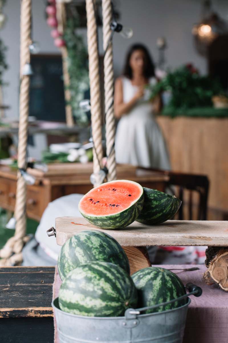 Halved watermelon on cutting board